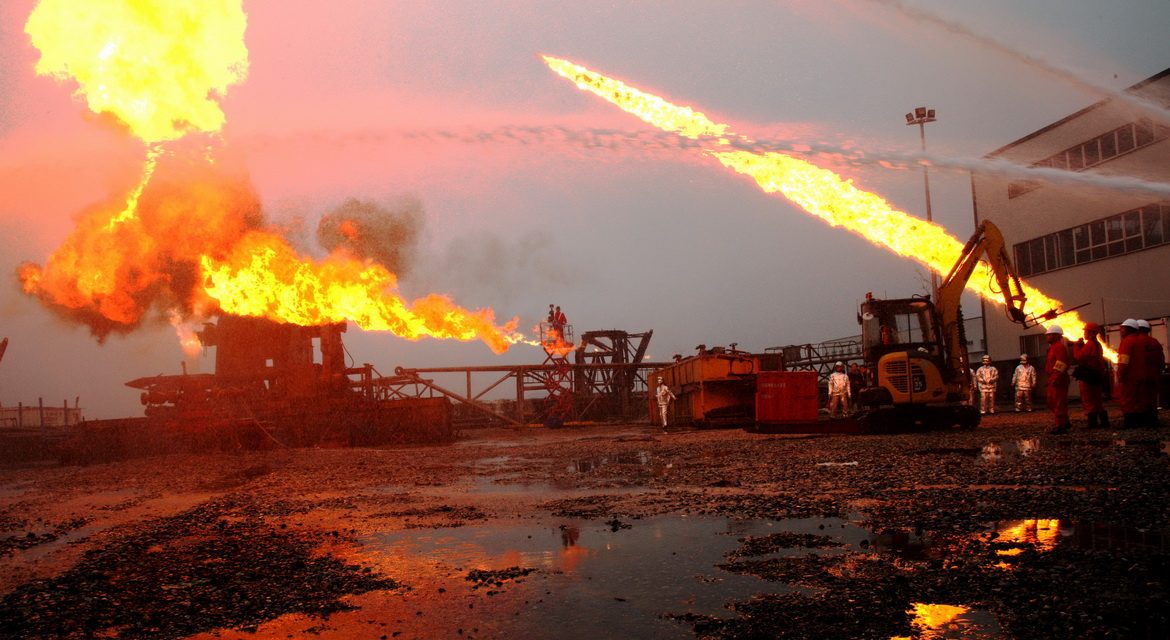 A CCDC well control team fighting a wellhead fire